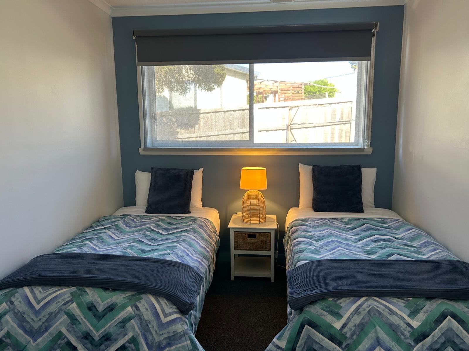 Second bedroom with twin single beds in Apartment One
