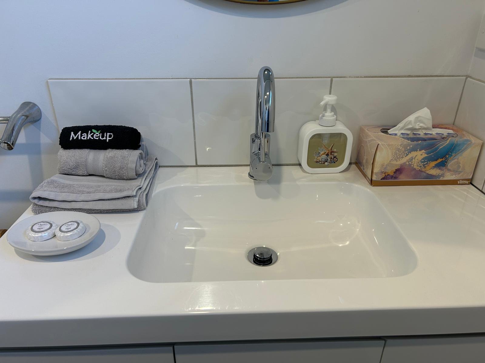 Bathroom vanity and basin in Apartment One