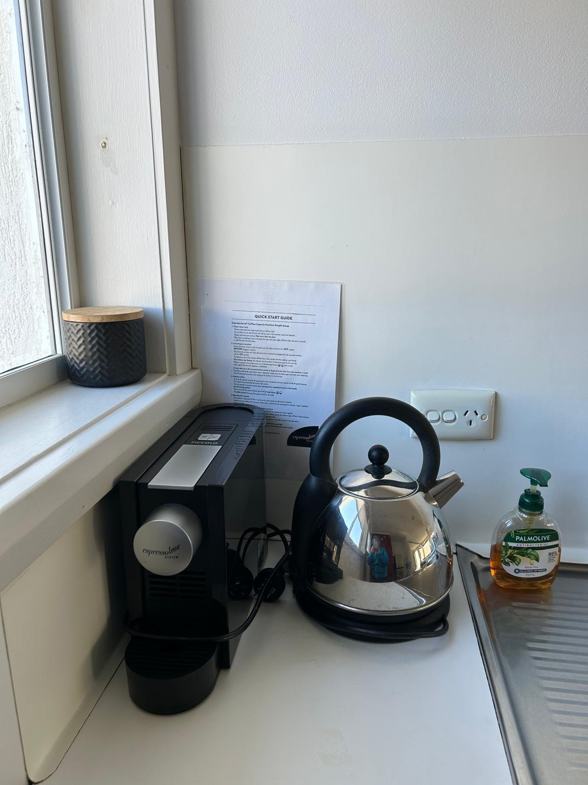 Kettle and coffee machine in the kitchen of Apartment One
