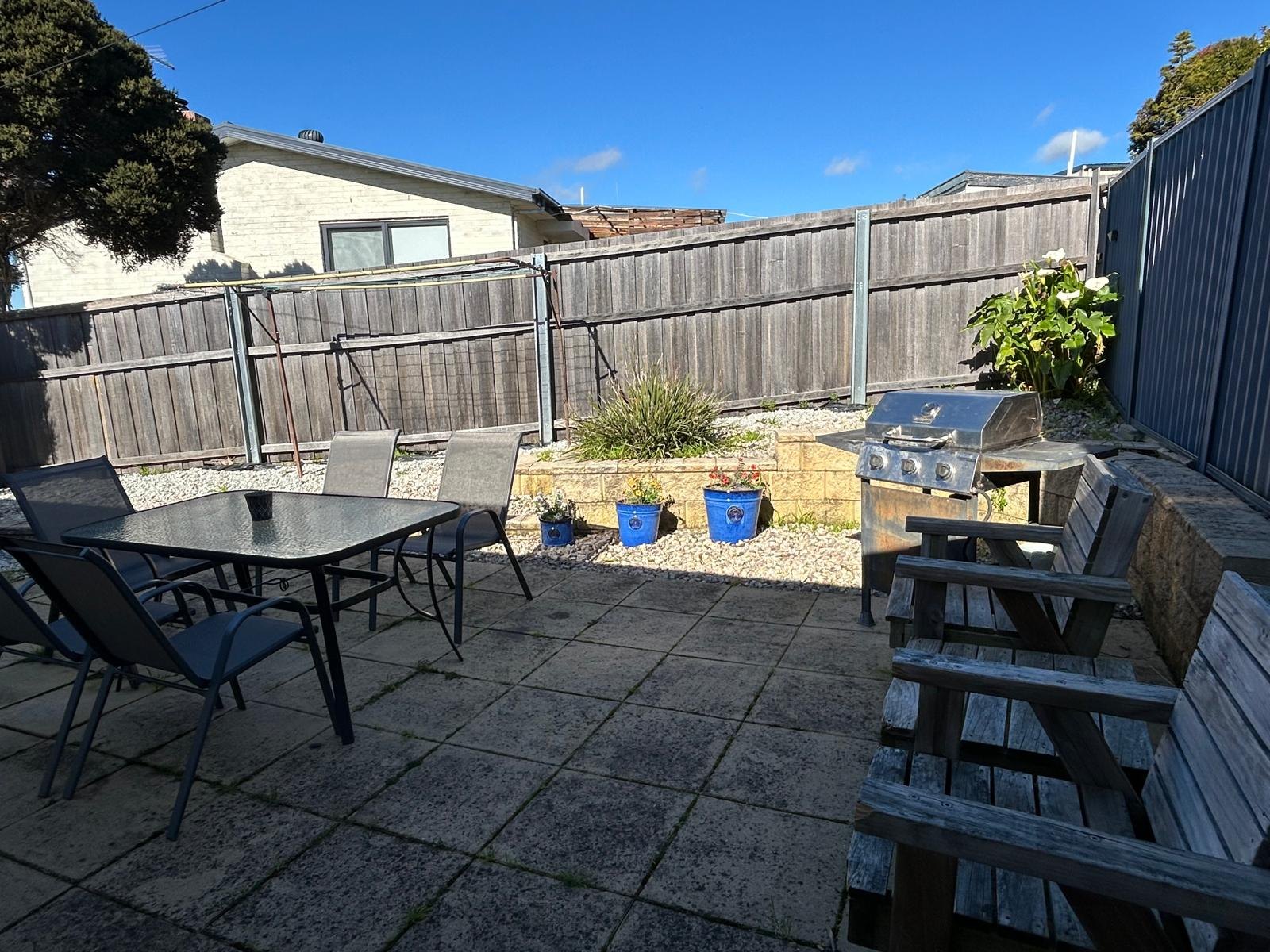 Private courtyard with barbeque and outdoor dining