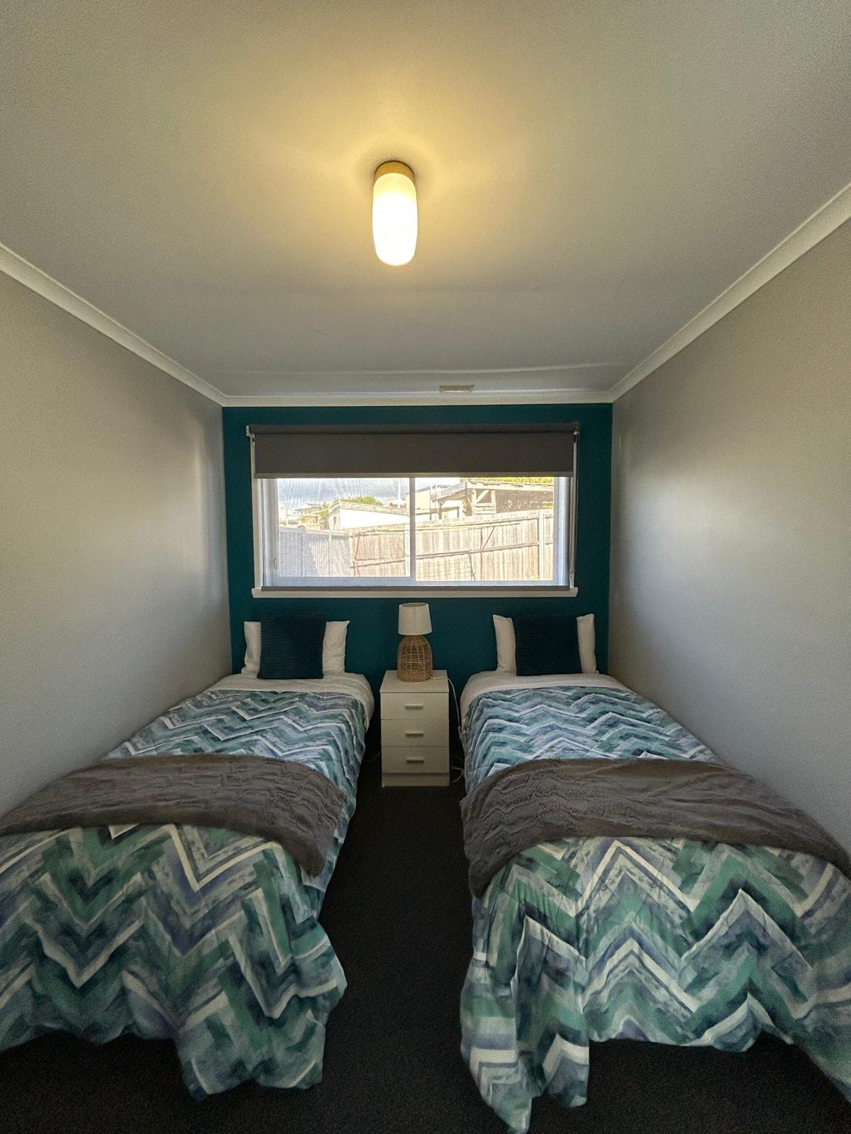 Second bedroom with twin single beds in Apartment Two