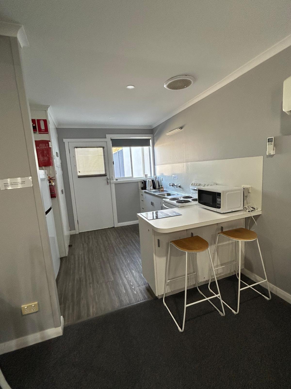 Fully equipped kitchen with breakfast bar in Apartment Two