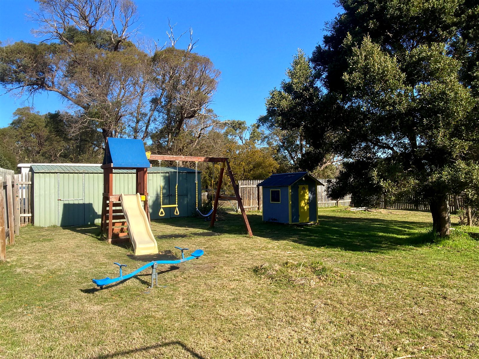 The secure backyard with playset, on the two acre block