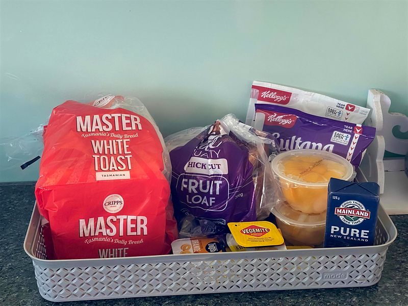Breakfast basket supplied for guests with bread, fruit loaf and juice