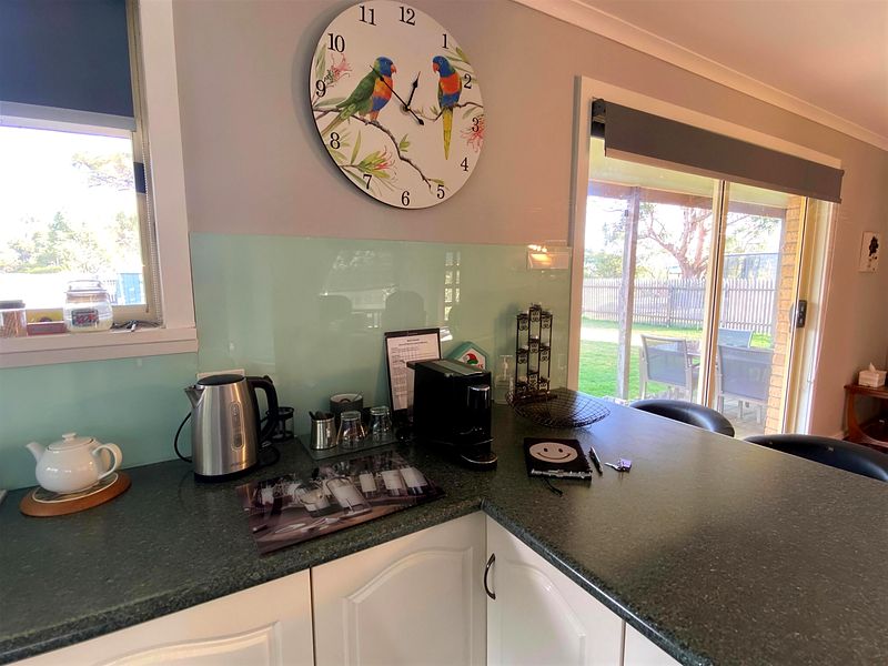 Coffee and tea station with pod coffee machine and teapot