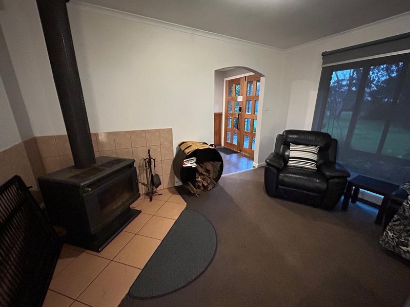 Living room with wood fire and recliners