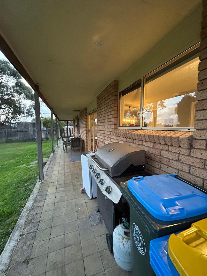 Covered verandah running along the house, with barbeque